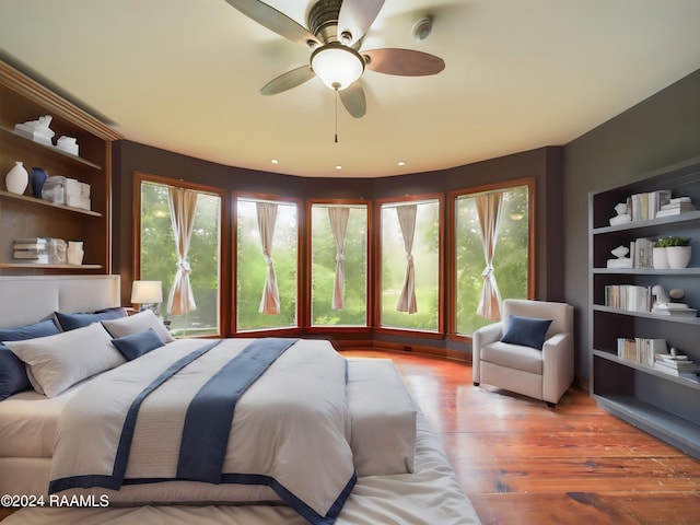 bedroom with hardwood / wood-style floors and ceiling fan