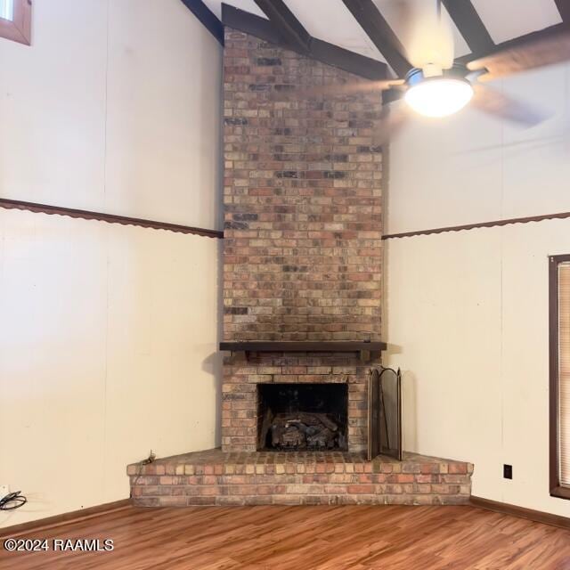 unfurnished living room featuring wood-type flooring and a fireplace