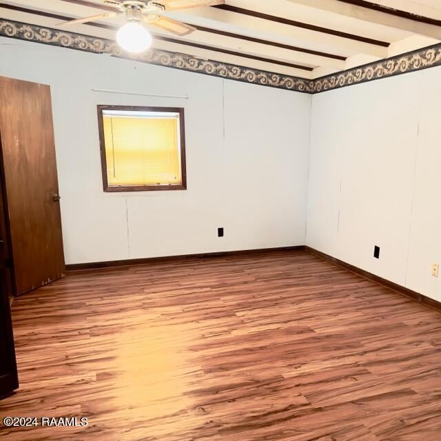 empty room featuring ceiling fan, beam ceiling, and light hardwood / wood-style flooring