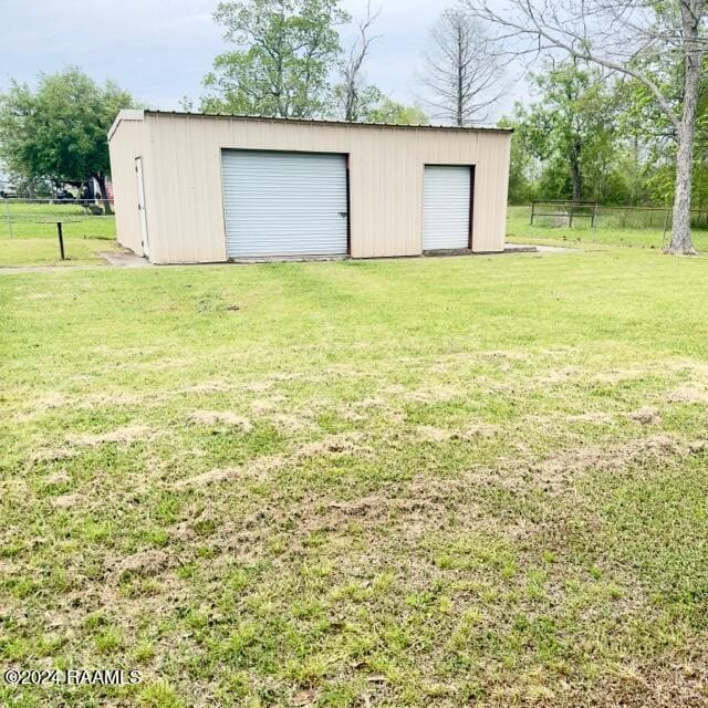 garage with a yard