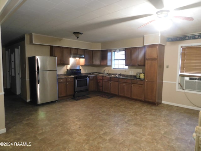 kitchen featuring tile floors, stainless steel fridge, black range with electric stovetop, and ceiling fan