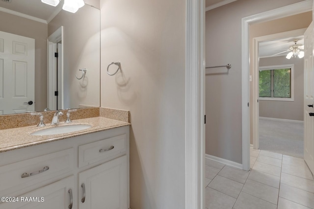 bathroom with tile floors, ceiling fan, vanity, and crown molding