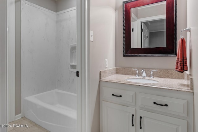 bathroom with tile flooring, shower / washtub combination, and vanity