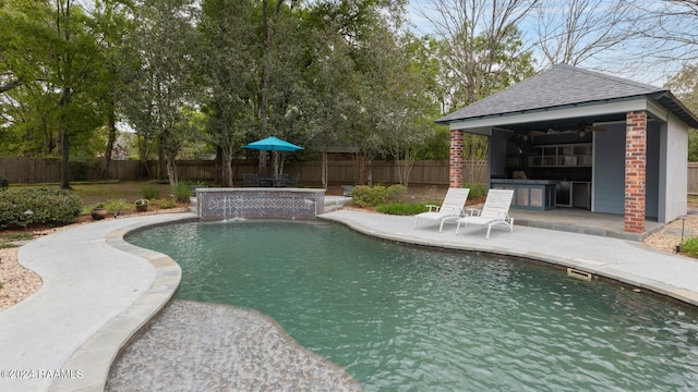 view of swimming pool featuring a patio area and pool water feature