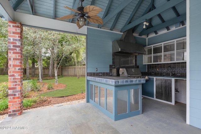 view of patio with grilling area, area for grilling, and ceiling fan