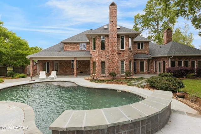 view of pool featuring a patio