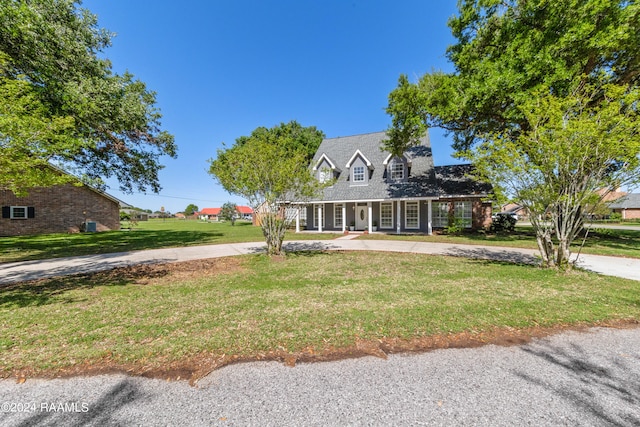 cape cod home with a porch and a front yard