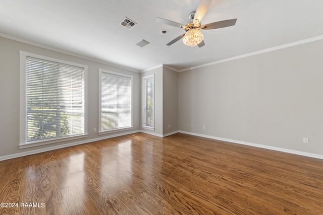 unfurnished room with hardwood / wood-style floors, ceiling fan, and ornamental molding