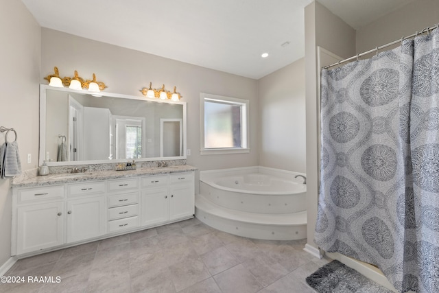 bathroom with tile patterned floors, vanity, and shower with separate bathtub