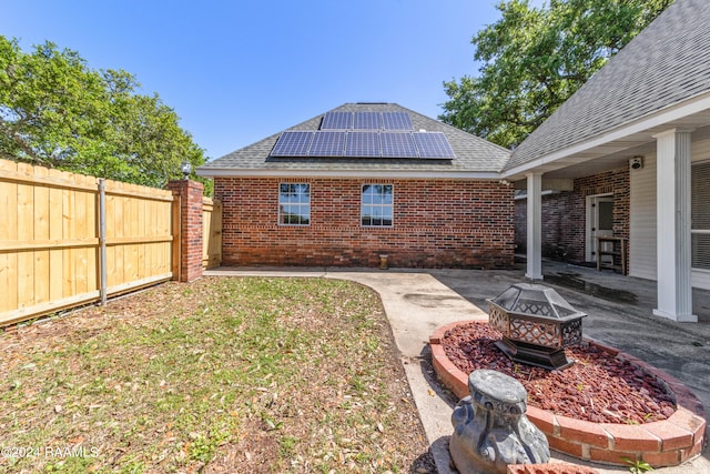 view of yard featuring a patio and a fire pit