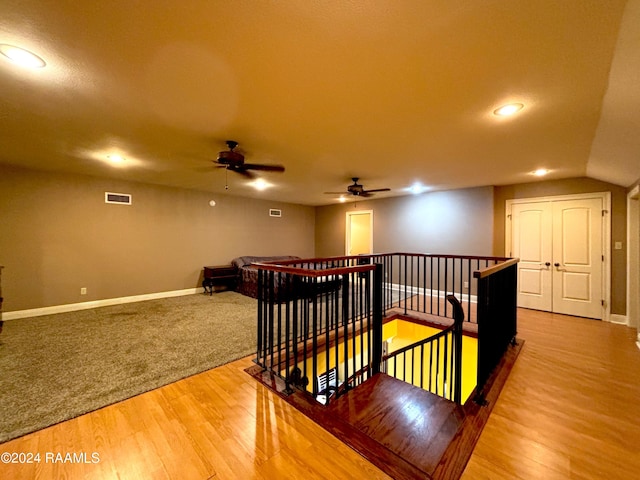 interior space with ceiling fan and light hardwood / wood-style flooring