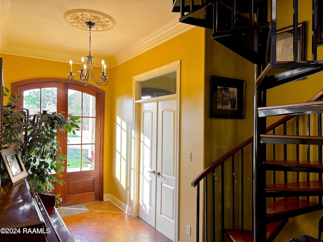 entryway featuring crown molding, a chandelier, and light tile floors