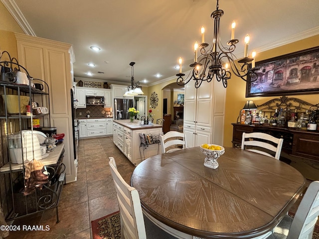 tiled dining space featuring ornamental molding and a chandelier