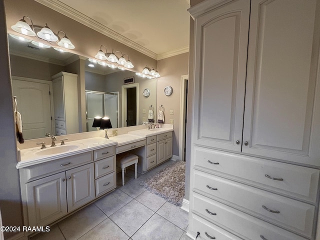 bathroom with tile flooring, crown molding, vanity with extensive cabinet space, and dual sinks