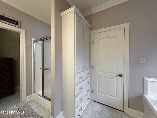 bathroom featuring walk in shower, tile flooring, and crown molding