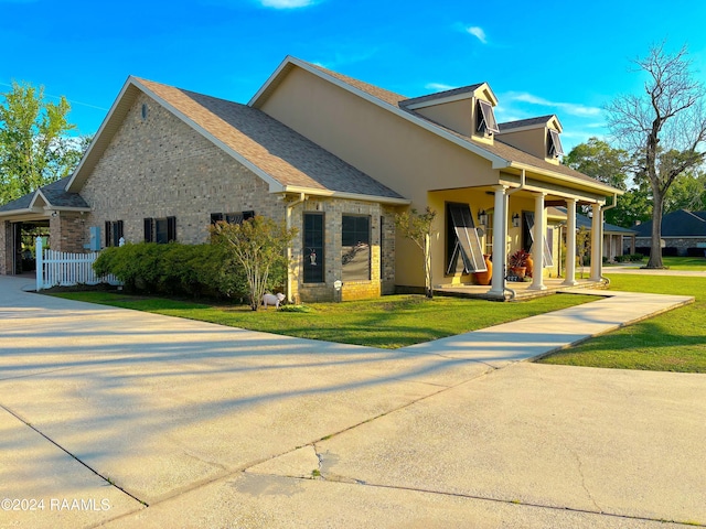 view of front of property with a porch and a front lawn