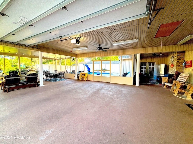 garage featuring ceiling fan and a garage door opener