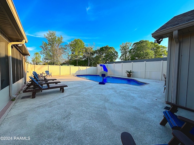 view of terrace featuring a fenced in pool