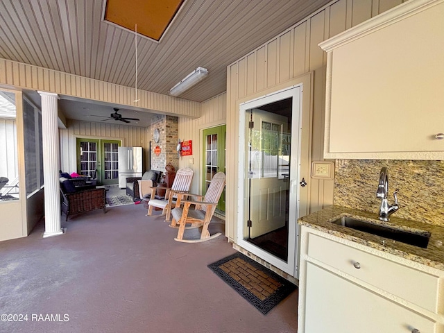 view of patio / terrace with ceiling fan and sink