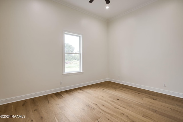 empty room with light hardwood / wood-style floors, ceiling fan, and crown molding