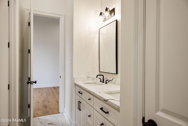 bathroom featuring hardwood / wood-style floors and vanity