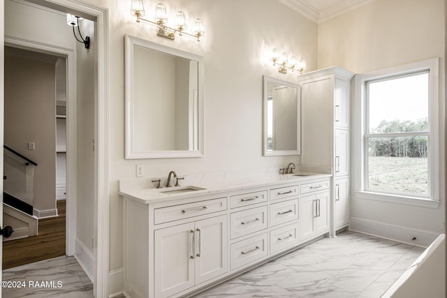 bathroom with vanity and ornamental molding