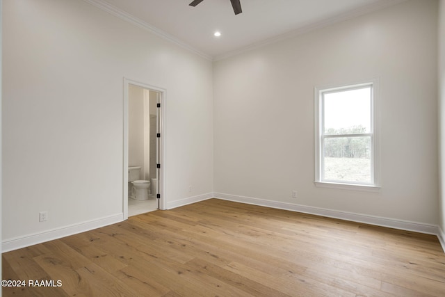 unfurnished room featuring ceiling fan, light hardwood / wood-style floors, and crown molding