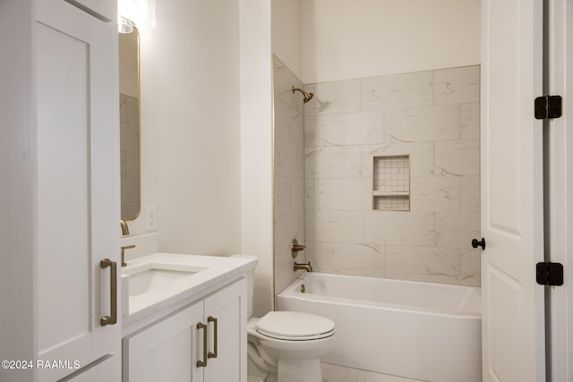 full bathroom featuring vanity, toilet, and tiled shower / bath