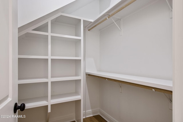 walk in closet featuring hardwood / wood-style flooring