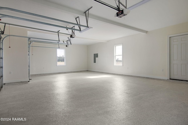 garage featuring electric panel and a garage door opener