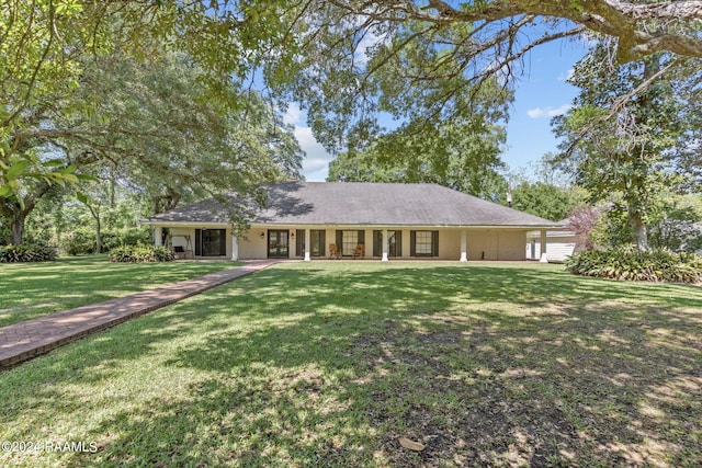 ranch-style home featuring a front yard