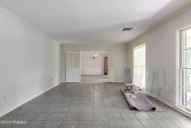 tiled empty room with a chandelier and crown molding