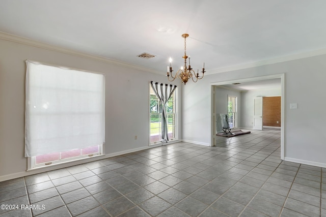 empty room with a notable chandelier, dark tile floors, and crown molding