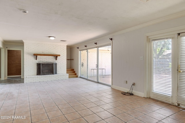 unfurnished living room with light tile floors and a brick fireplace