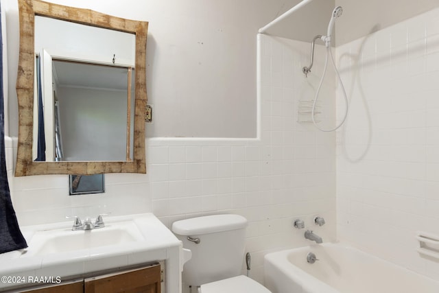 full bathroom with tiled shower / bath combo, vanity, tile walls, tasteful backsplash, and toilet