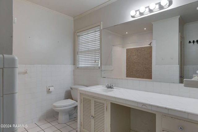 bathroom with tile walls, oversized vanity, toilet, and tile flooring