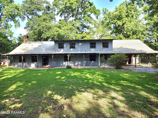 back of house featuring a yard