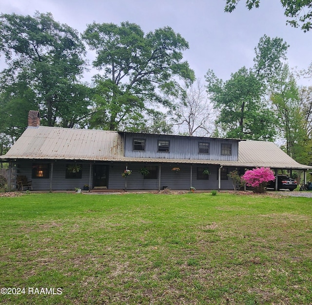 back of house with a yard