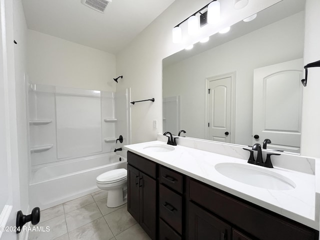 full bathroom with tile patterned flooring, vanity, washtub / shower combination, and toilet