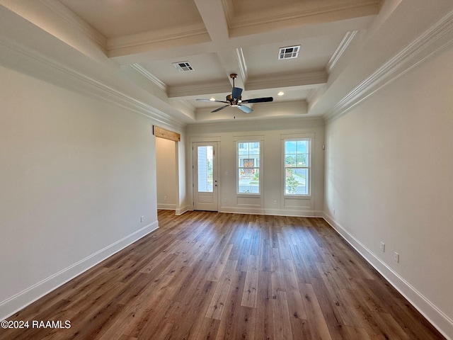 unfurnished room featuring ornamental molding, hardwood / wood-style floors, ceiling fan, and beam ceiling