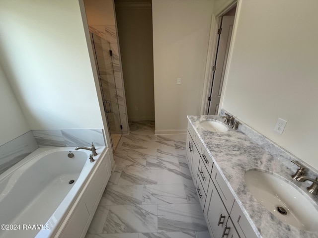 bathroom featuring vanity and separate shower and tub