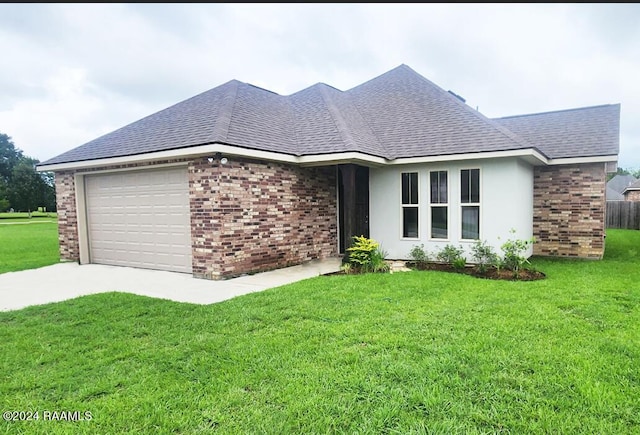 ranch-style home featuring a garage and a front yard