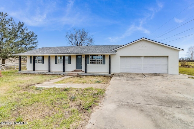 ranch-style house featuring covered porch and a garage