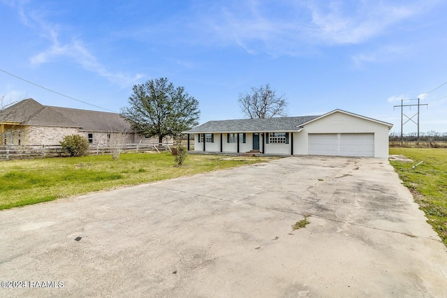 single story home with a front yard and a garage