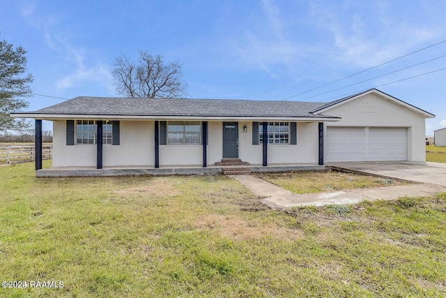 ranch-style home with covered porch, a front lawn, and a garage