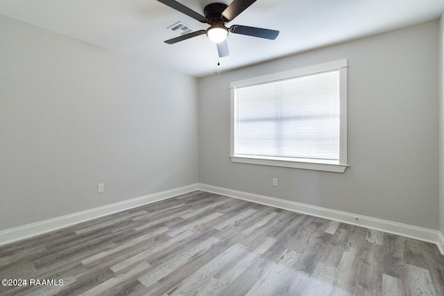 unfurnished room with ceiling fan and light wood-type flooring