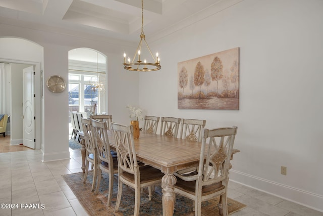 dining room featuring a notable chandelier, coffered ceiling, and light tile flooring