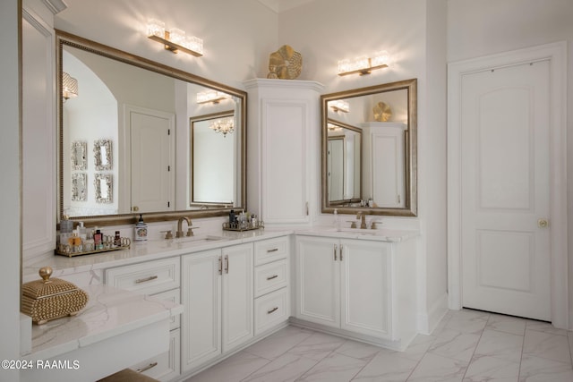 bathroom featuring dual sinks, tile flooring, and large vanity