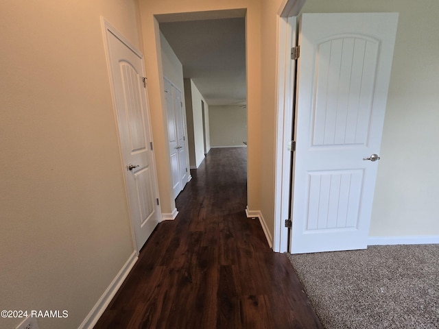 corridor with dark wood-type flooring