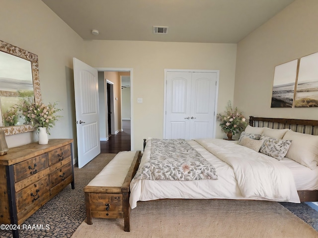 bedroom featuring hardwood / wood-style floors and a closet